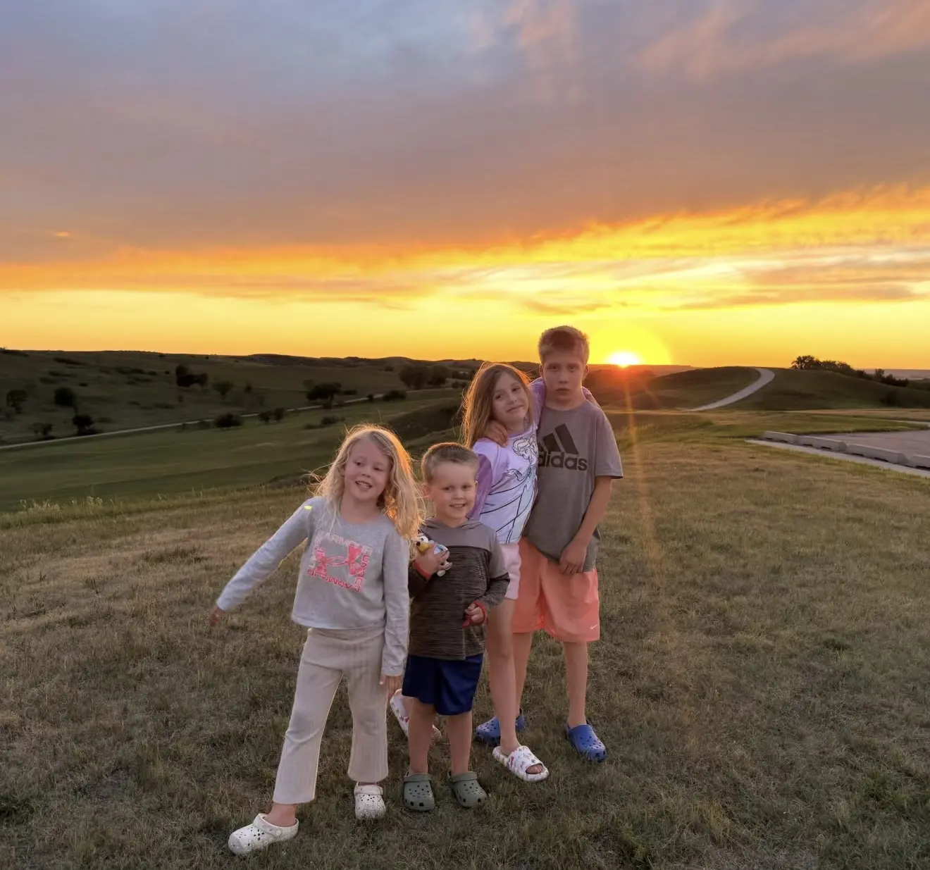 Quincy, Chaney, Sloane, and Palmer together at sunset